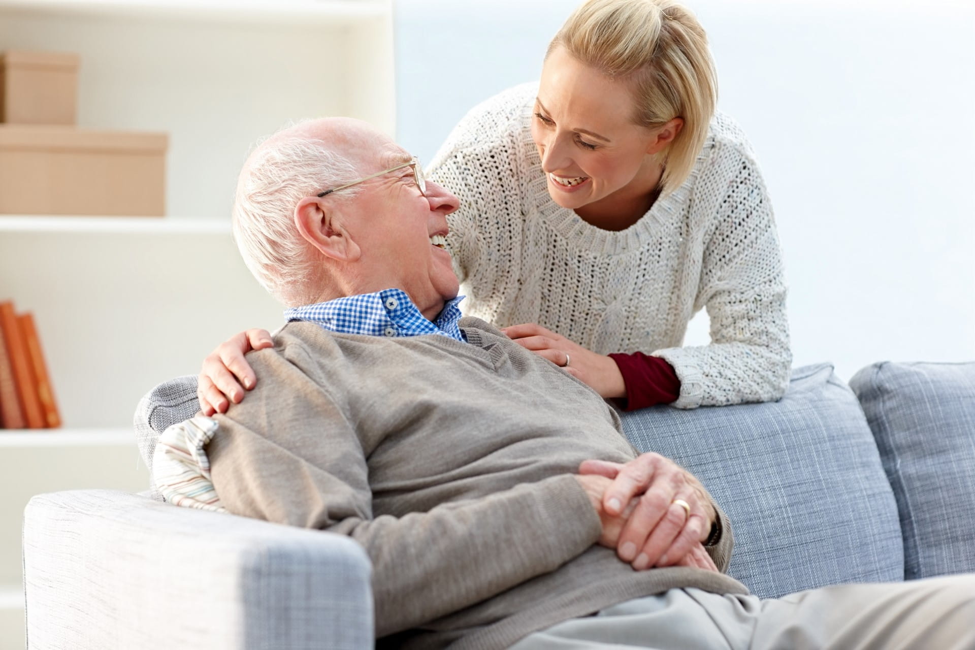 Happy elderly father daughter looking at each other smiling